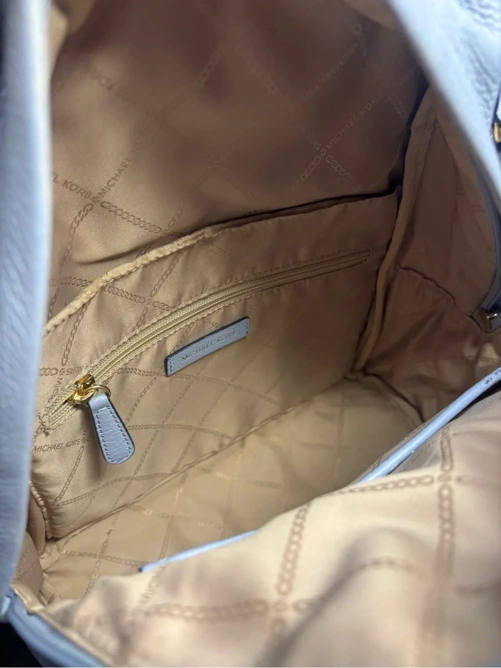 Michael Kors Slater Medium Pebbled Leather Backpack in a pale blue with dust bag